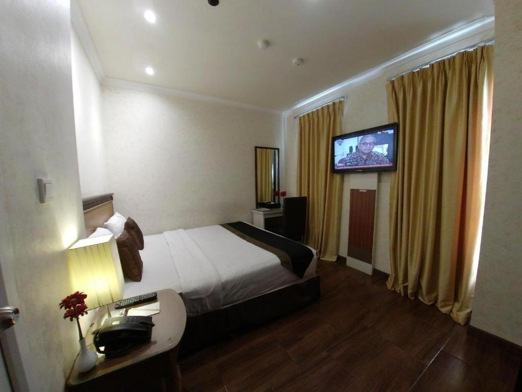 Amos Cozy Hotel Melawai Jakarta Bagian luar foto